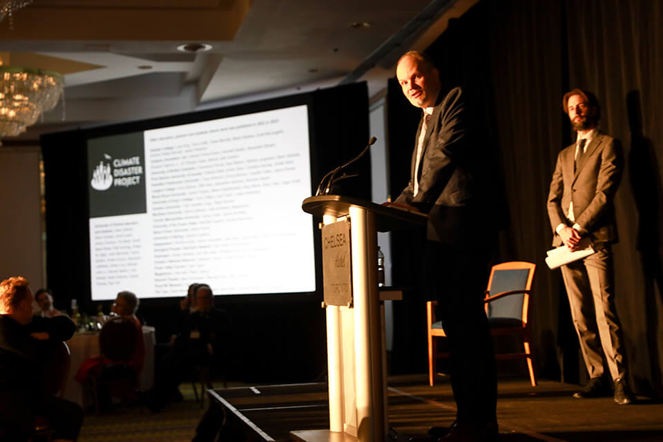 UVic’s Wayne Crookes Professor of Environmental and Climate Journalism Sean Holman addresses the National Newspaper Award audience.