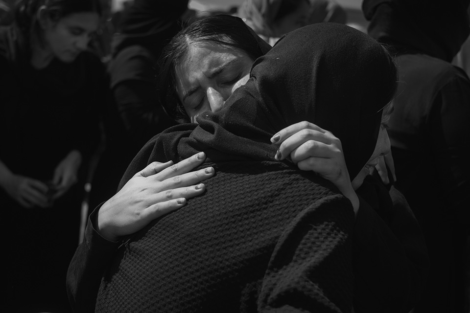 Yazidi families gather to search for missing relatives at Alo Antar, a large desert pit near Tal Afar in northwestern Iraq.
