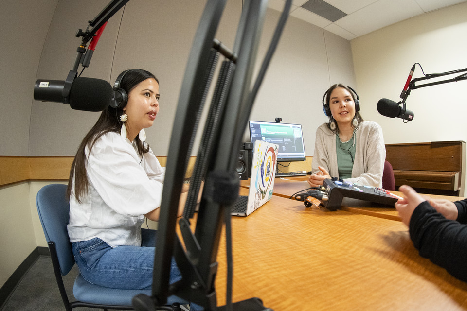 UVic students Tiffany Friesen and Haylee Gardiner in a podcast studio.