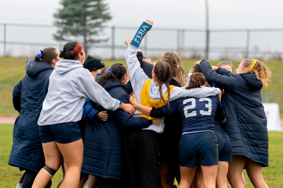 The women’s rugby team gather for a post game celebration after punching their ticket to the national final.