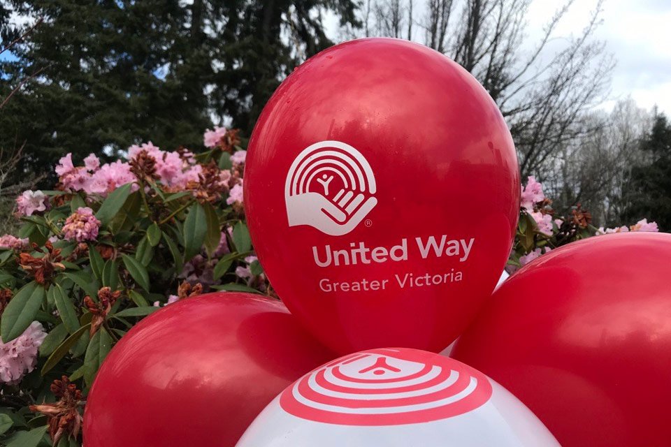 A bundle of red and white United Way balloons