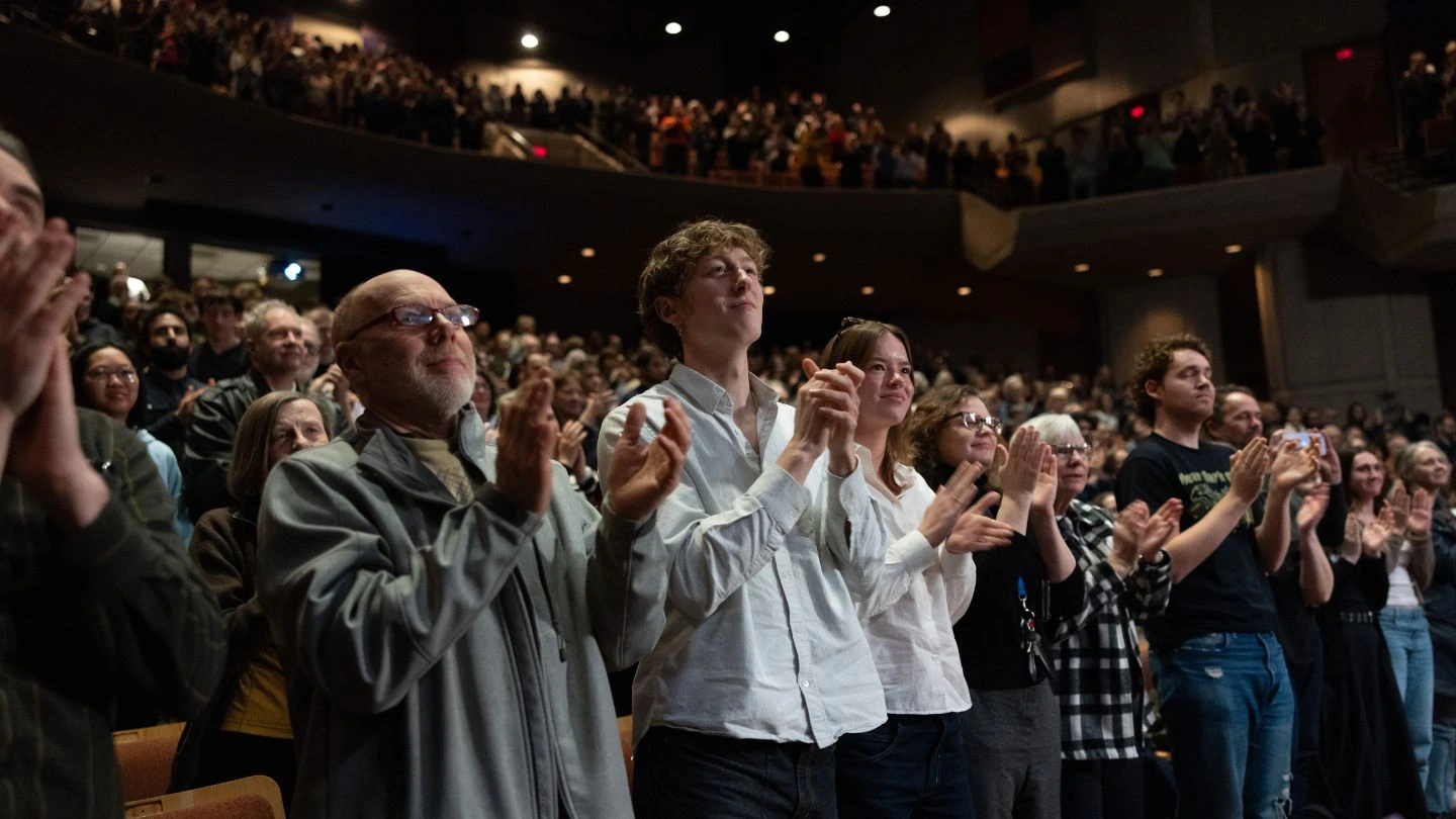 The audience offers David Suzuki a second standing ovation at the event's conclusion. 